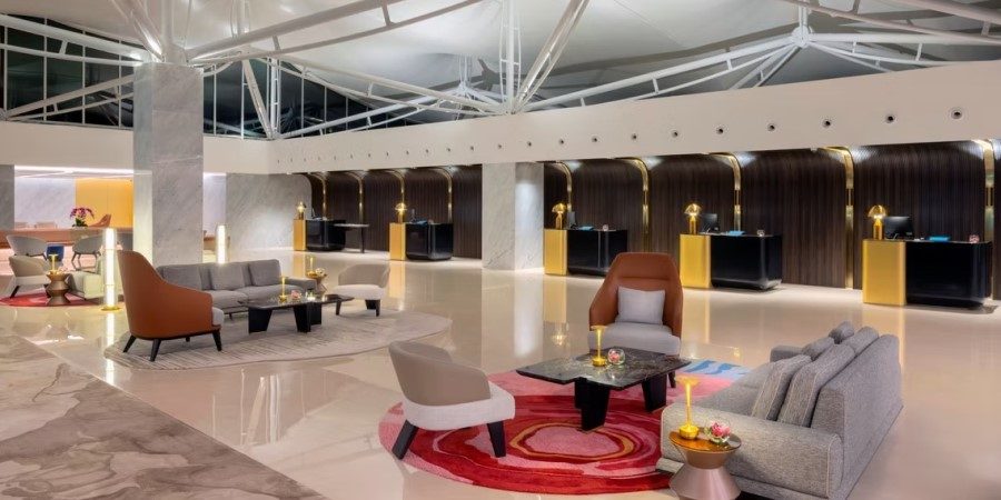 Stylish hotel lobby with modern furnishings, showcasing a blend of comfort and contemporary design elements.